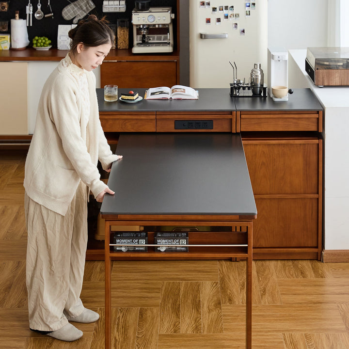 Vintage boxwood sintered stone extendable island dining table with cabinet skeletal in panoramic view.