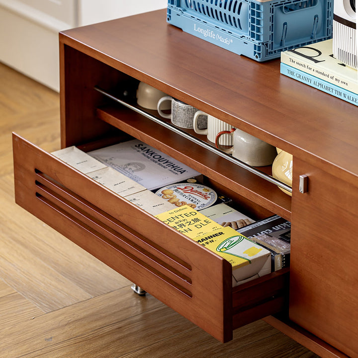 Vintage boxwood tv console pinecone in still life.
