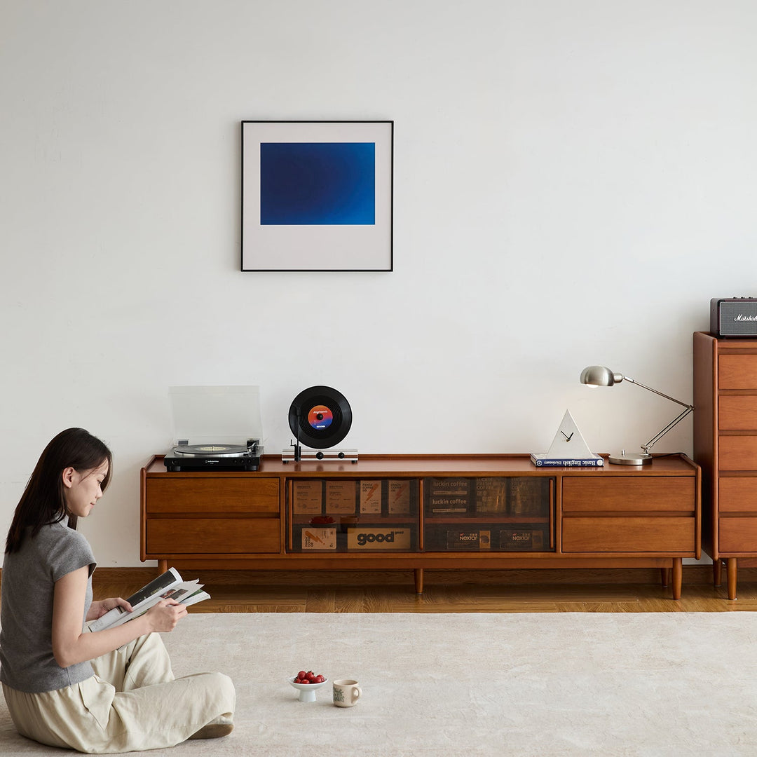 Vintage boxwood tv console vista in still life.