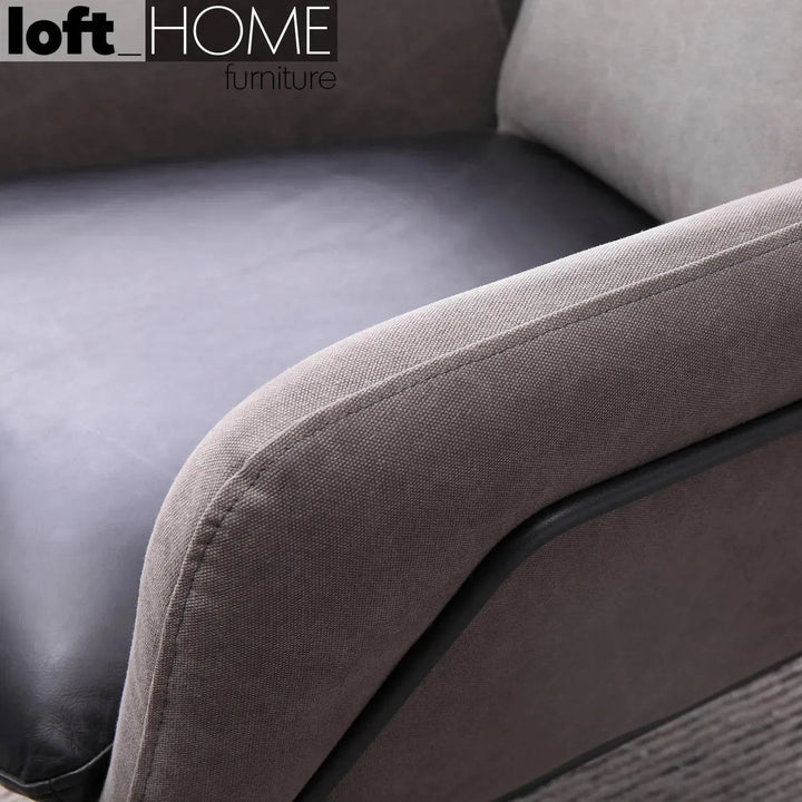 Industrial canvas and genuine leather 1 seater sofa cale in close up details.