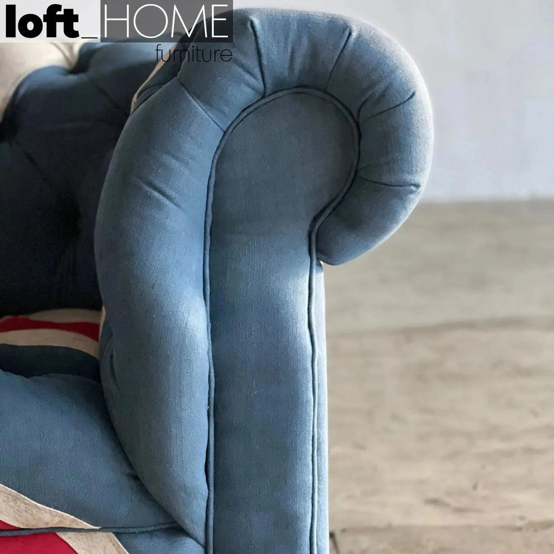 Vintage denim fabric 3 seater sofa union jack chesterfield in close up details.