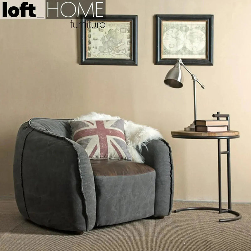 Vintage fabric and genuine leather 1 seater sofa bread in panoramic view.