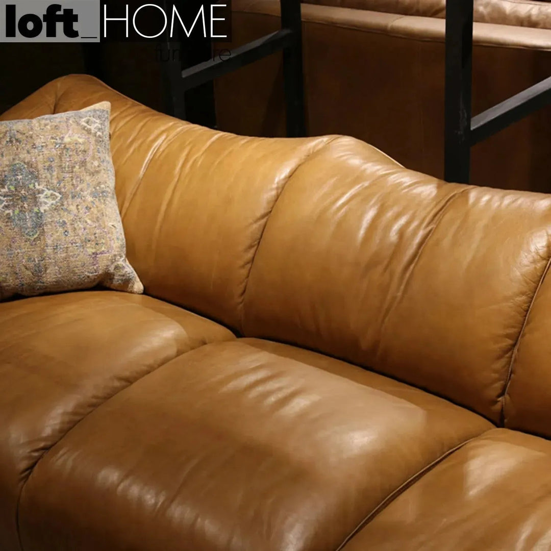 Vintage genuine leather 1 seater sofa beanbag with context.