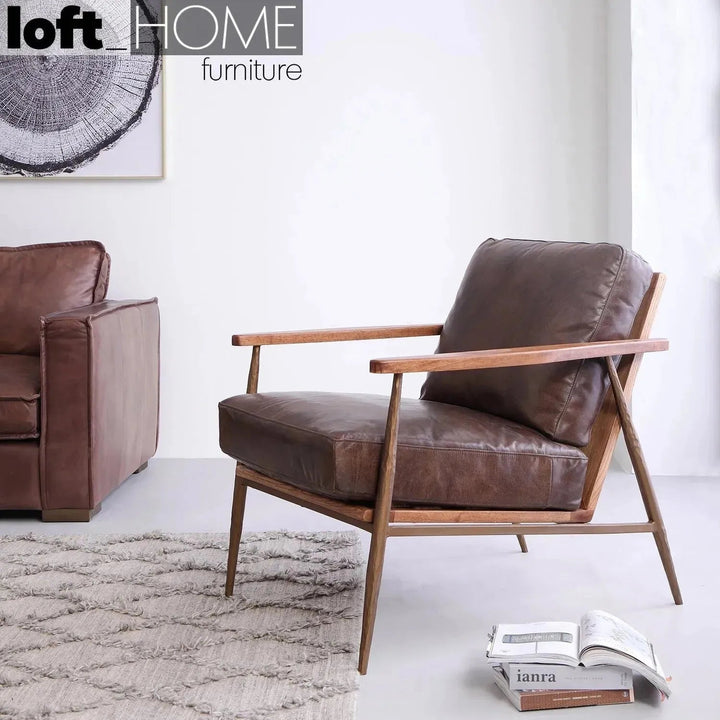 Vintage genuine leather 1 seater sofa hummer brass in details.