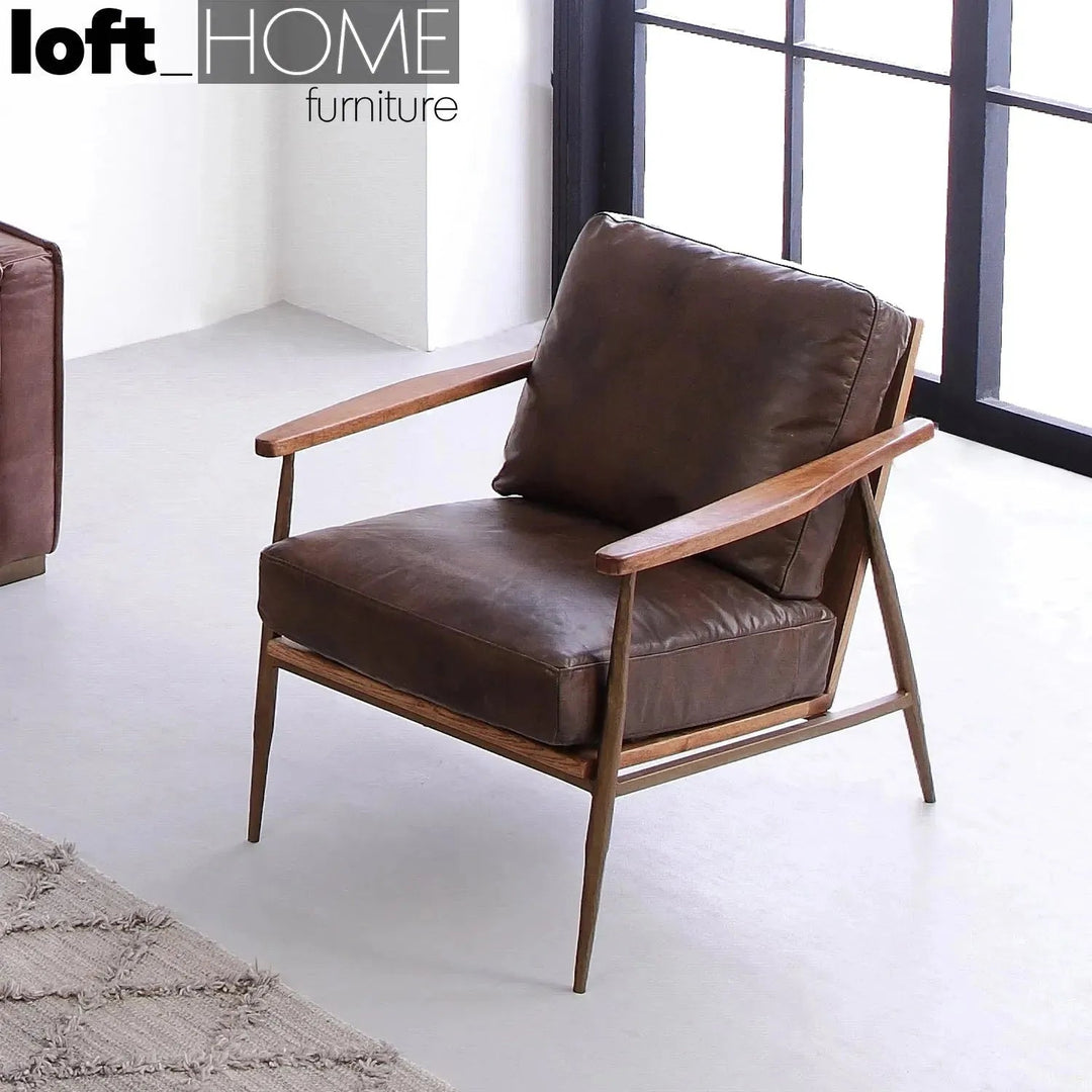 Vintage genuine leather 1 seater sofa hummer brass with context.