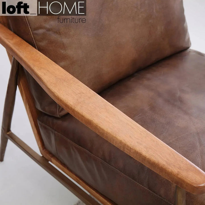 Vintage genuine leather 1 seater sofa hummer brass in panoramic view.