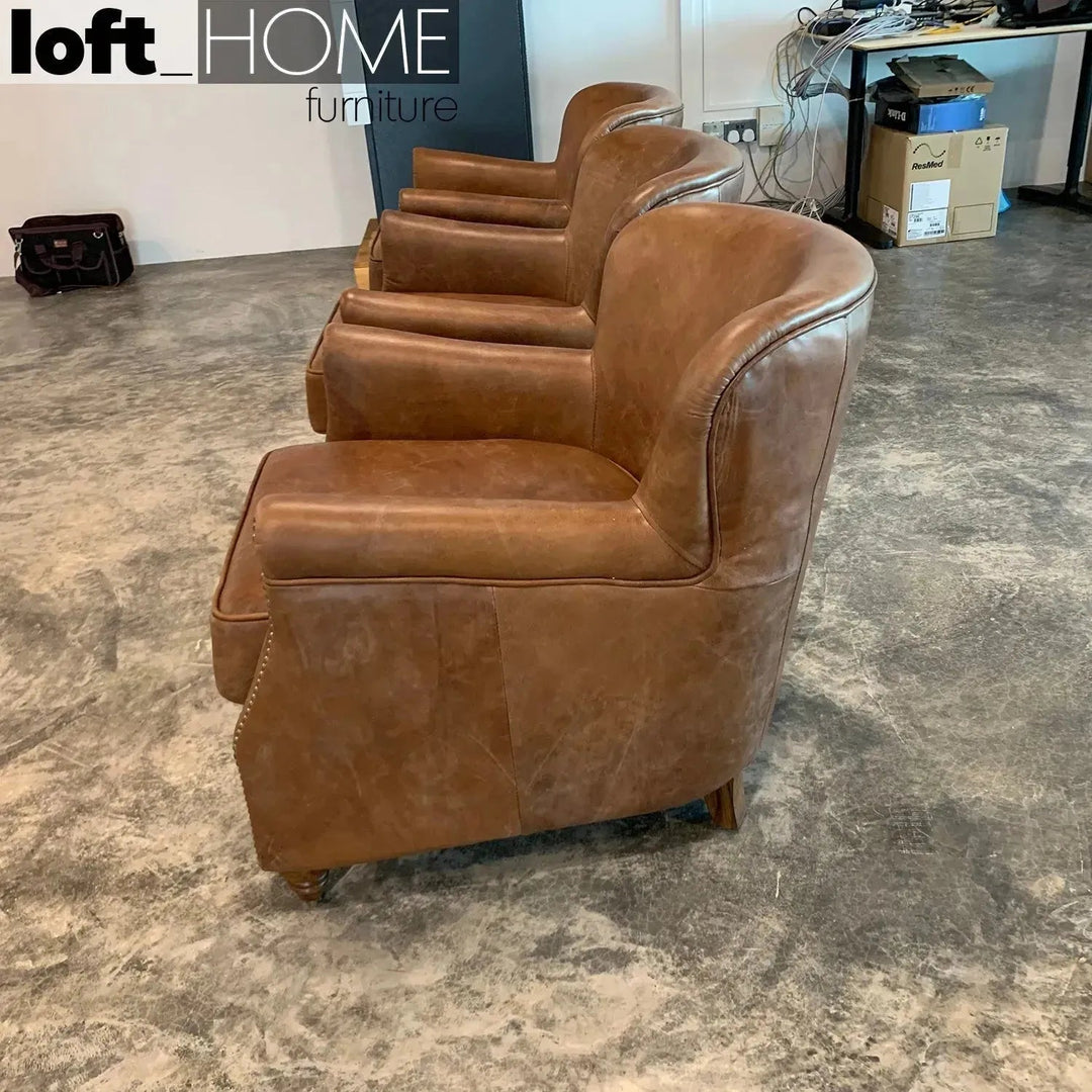 Vintage genuine leather 1 seater sofa professor in close up details.
