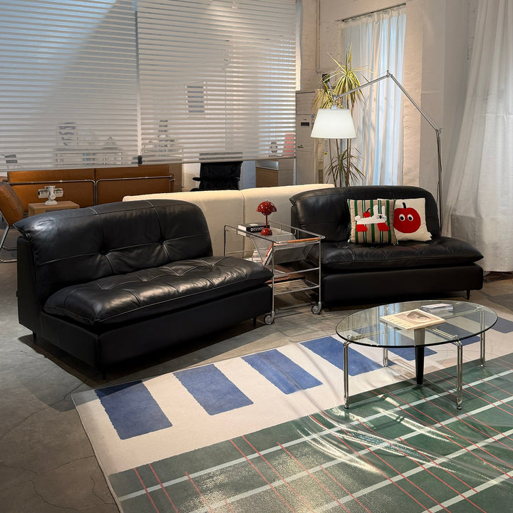 Vintage genuine leather 1 seater sofa riga in panoramic view.