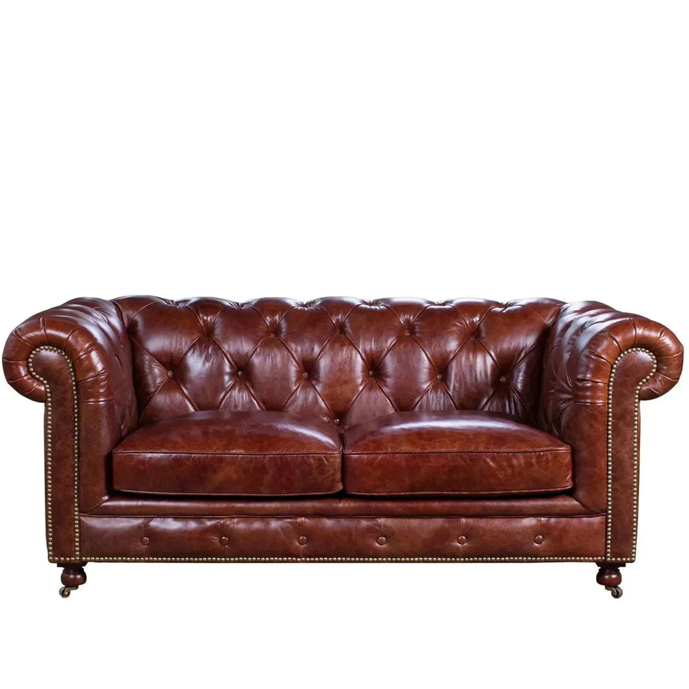 Vintage genuine leather 2 seater sofa chesterfield classic in white background.