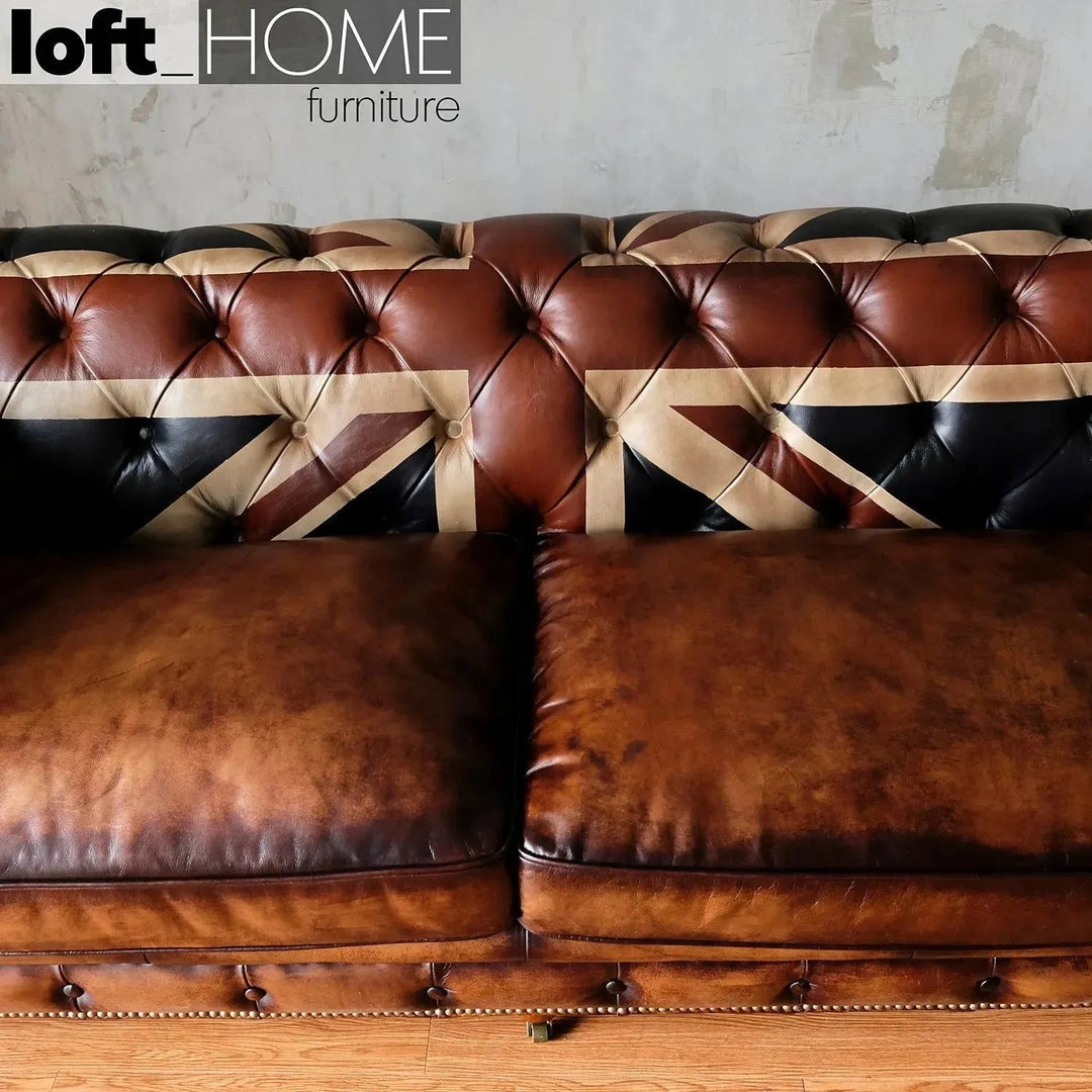 Vintage genuine leather 2 seater sofa chesterfield union jack in panoramic view.
