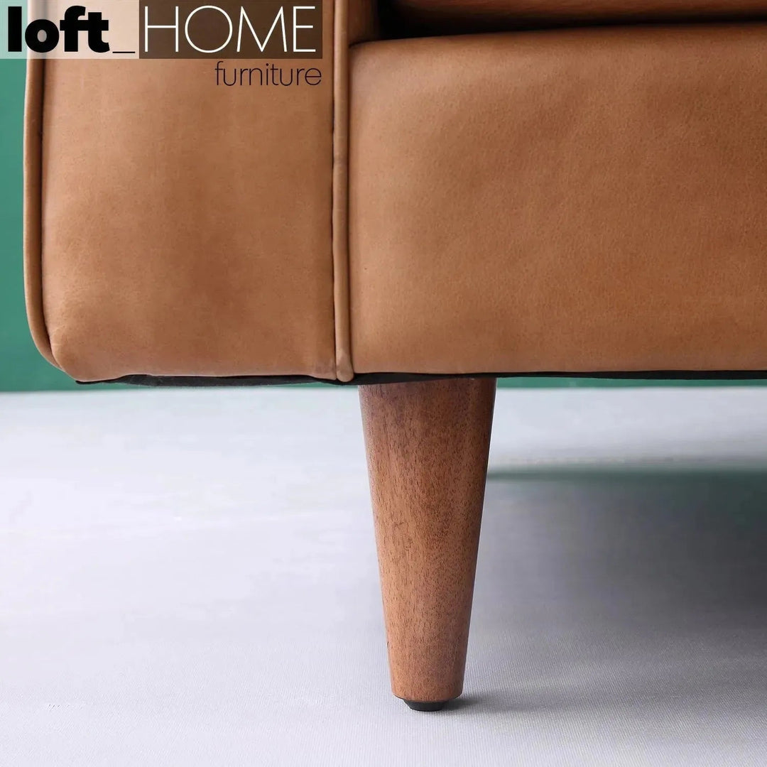 Vintage genuine leather 2 seater sofa olga in still life.