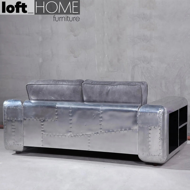 Industrial genuine leather 2 seater sofa silver aircraft in close up details.