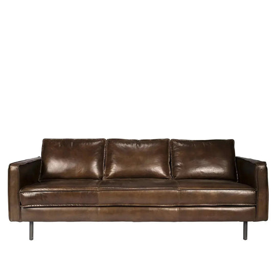 Vintage genuine leather 3 seater sofa belgian in white background.