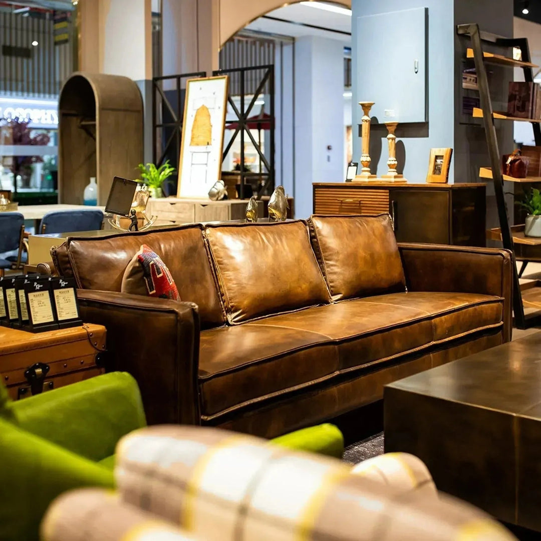 Vintage genuine leather 3 seater sofa belgian in still life.