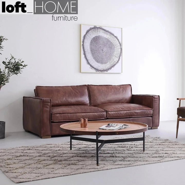 Vintage genuine leather 3 seater sofa brown whisky in real life style.