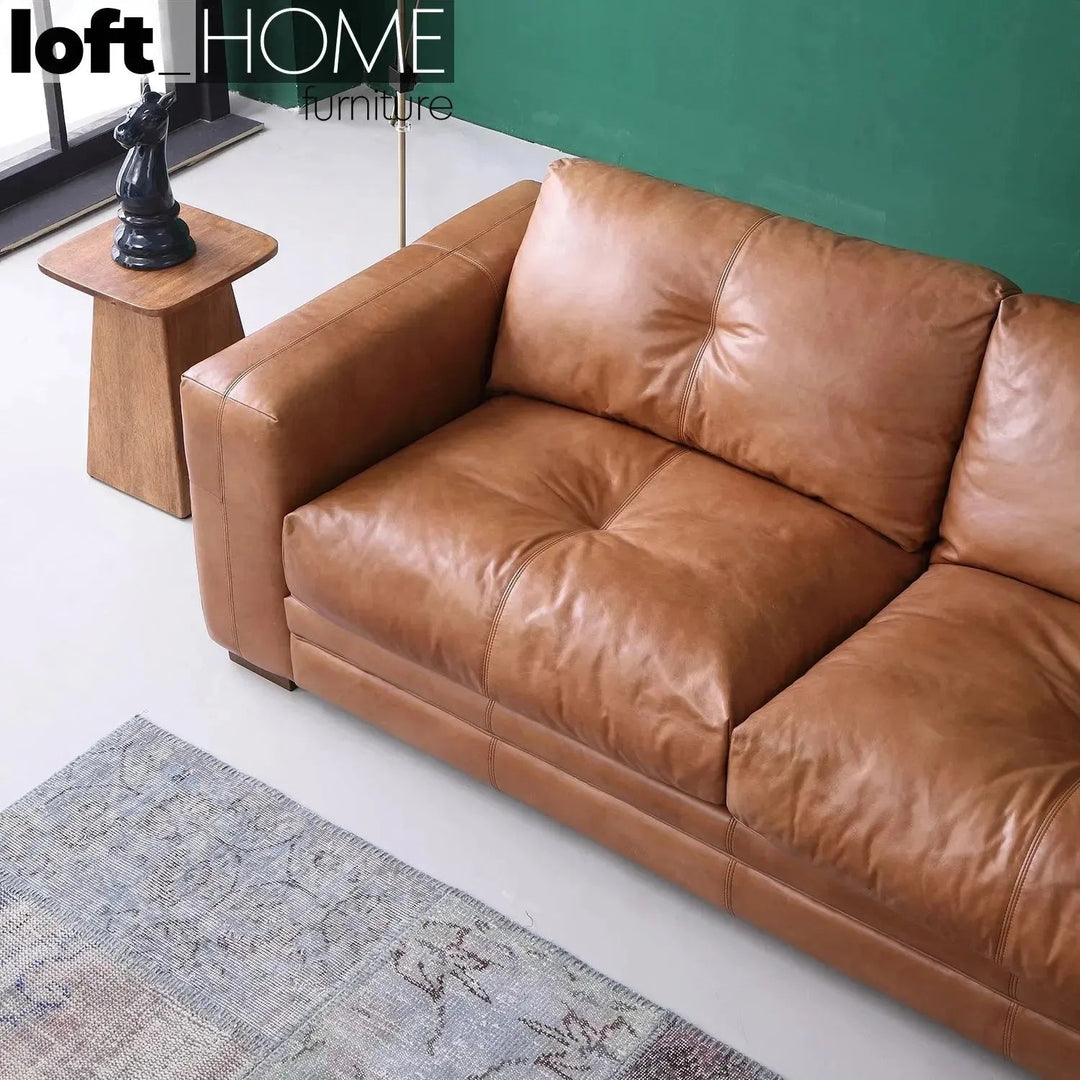 Vintage genuine leather 3 seater sofa canvas ter in close up details.