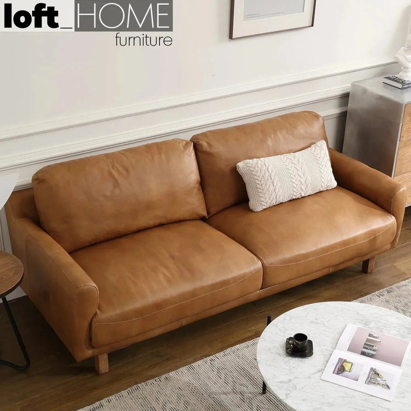 Vintage genuine leather 3 seater sofa rw and nut ter with context.