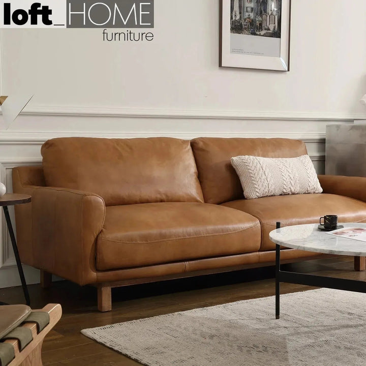Vintage genuine leather 3 seater sofa rw and nut ter in real life style.