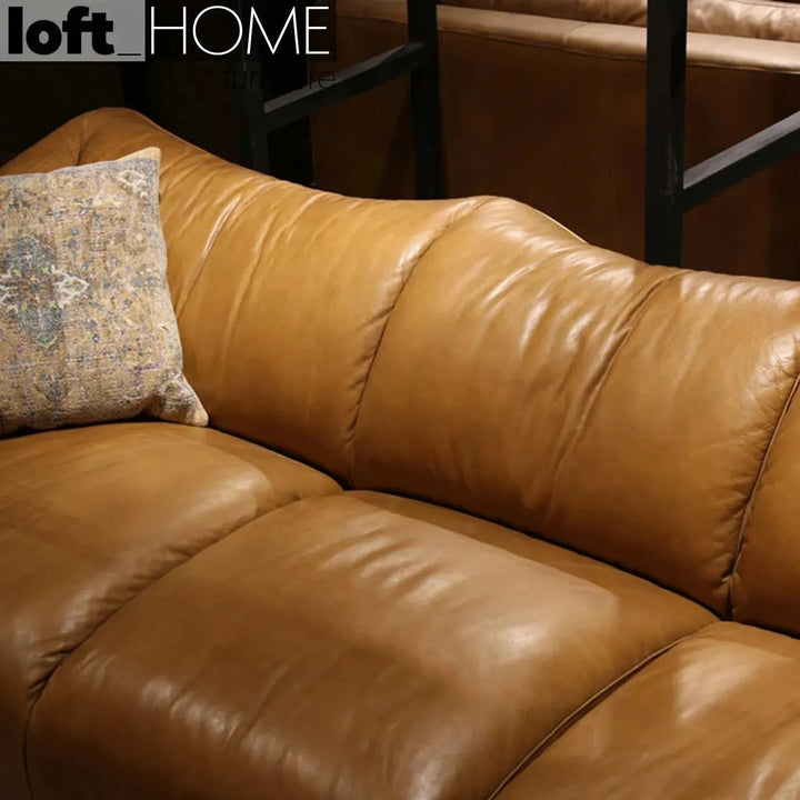 Vintage genuine leather 4 seater sofa beanbag with context.