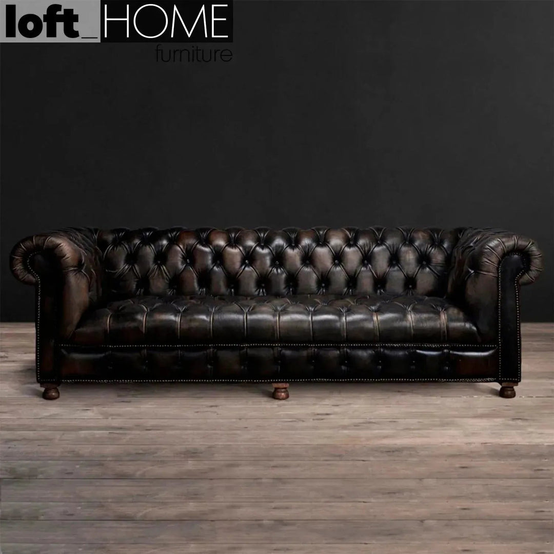 Vintage genuine leather 4 seater sofa chesterfield button with context.