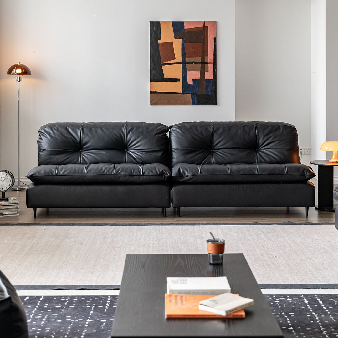 Vintage genuine leather 4 seater sofa riga with context.