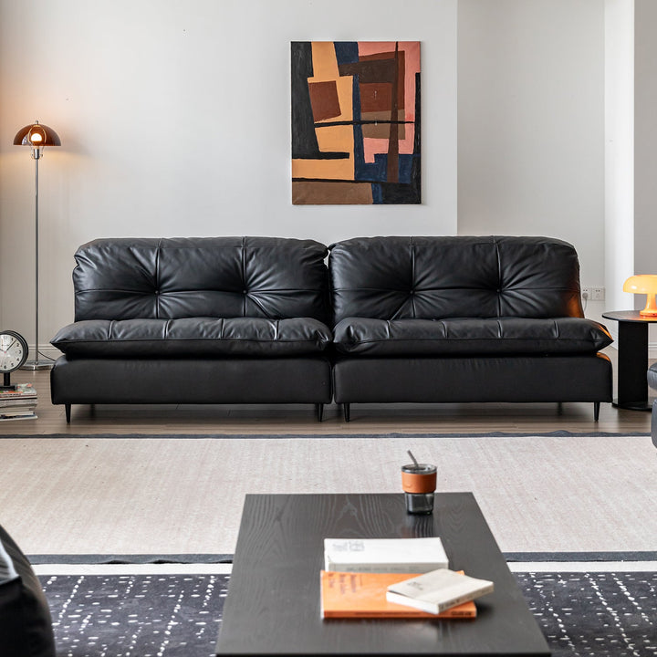 Vintage genuine leather 4 seater sofa riga with context.