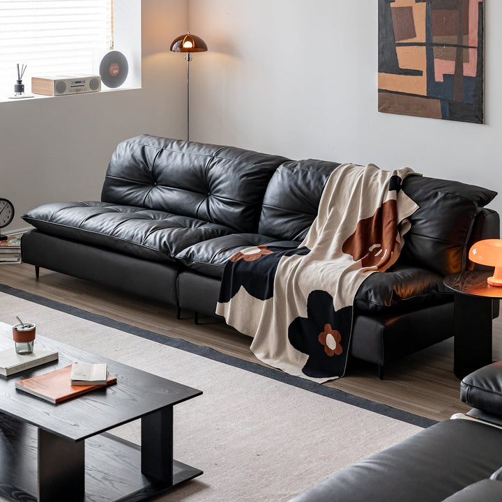 Vintage genuine leather 4 seater sofa riga in still life.