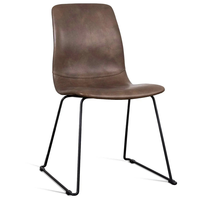 Bauhaus genuine leather dining chair oakley ii in white background.