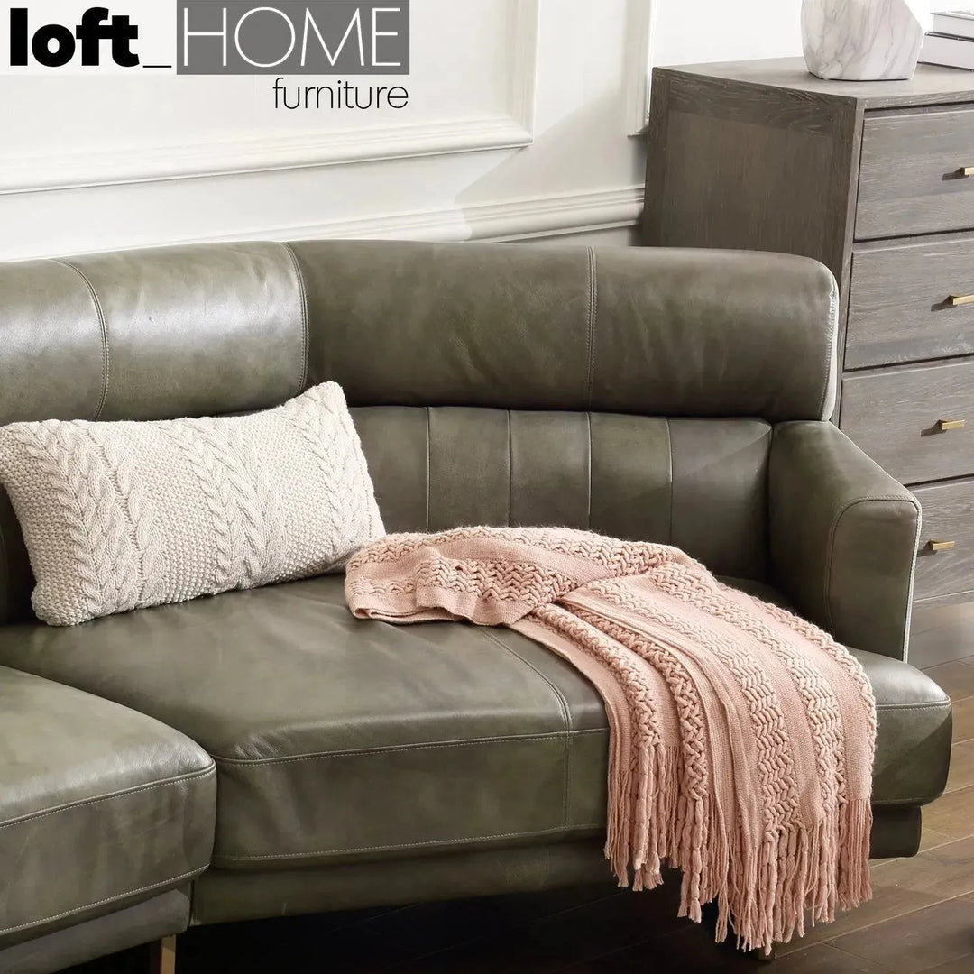 Vintage genuine leather l shape sofa green franco in panoramic view.