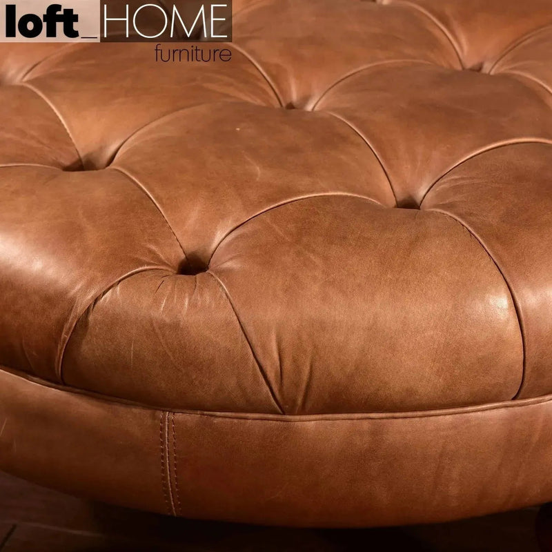 Vintage genuine leather ottoman sand in details.