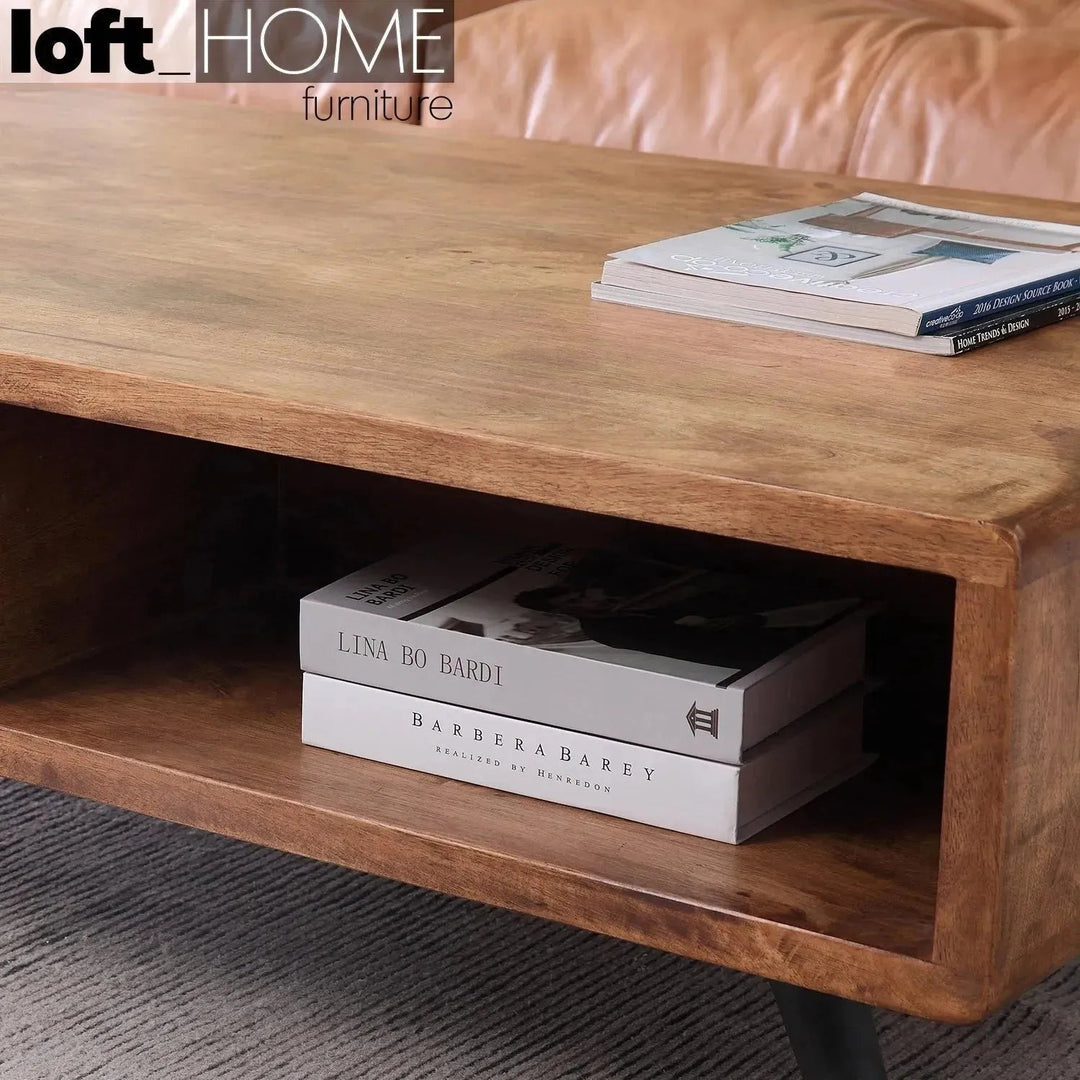 Industrial rubber wood coffee table serb with context.