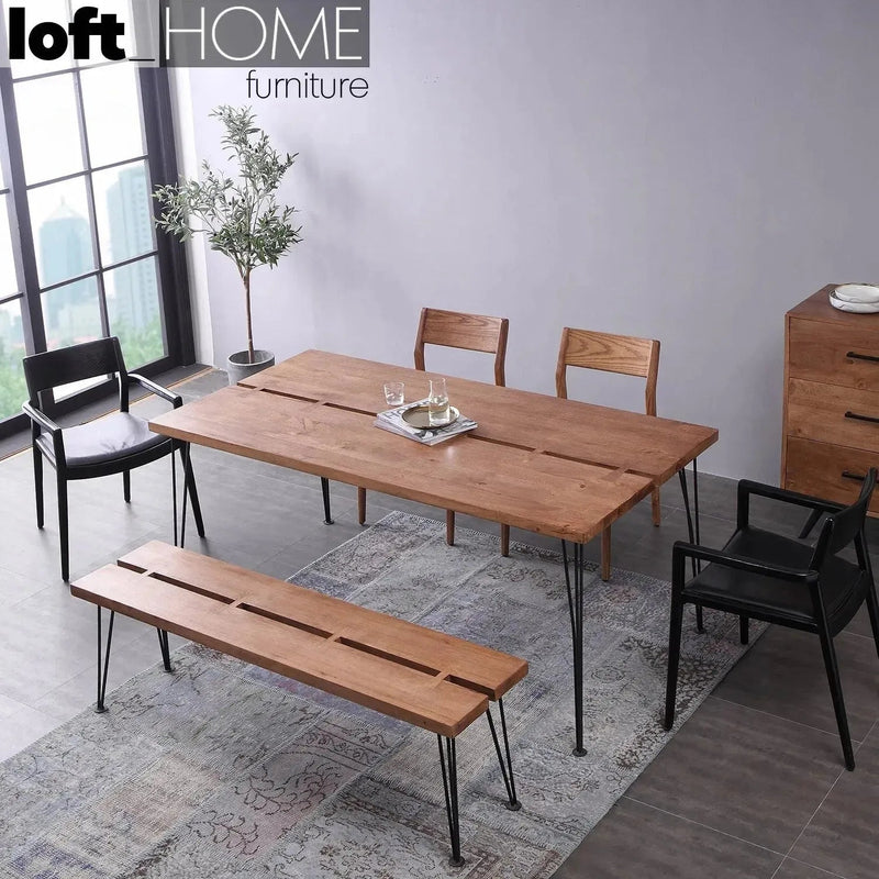 Industrial rubber wood dining bench dovetail in close up details.