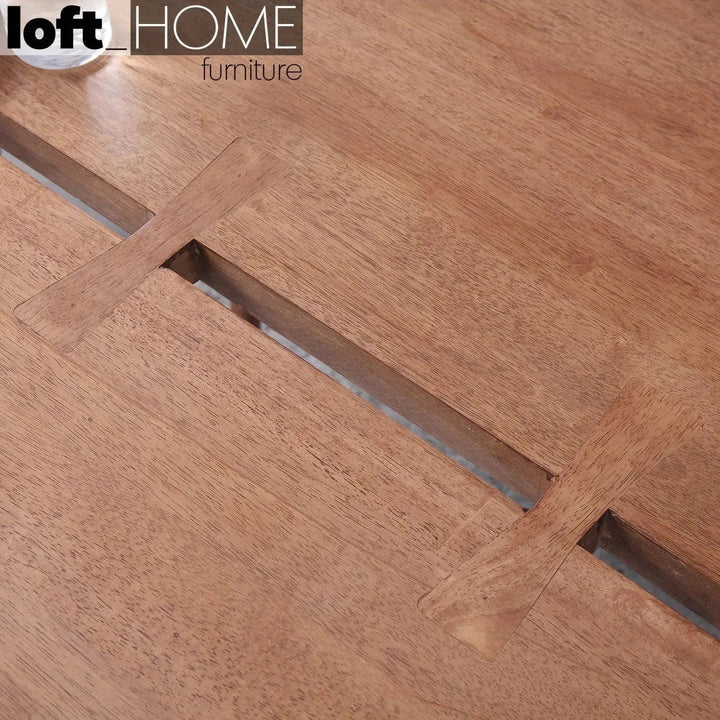 Industrial rubber wood dining table dovetail in close up details.