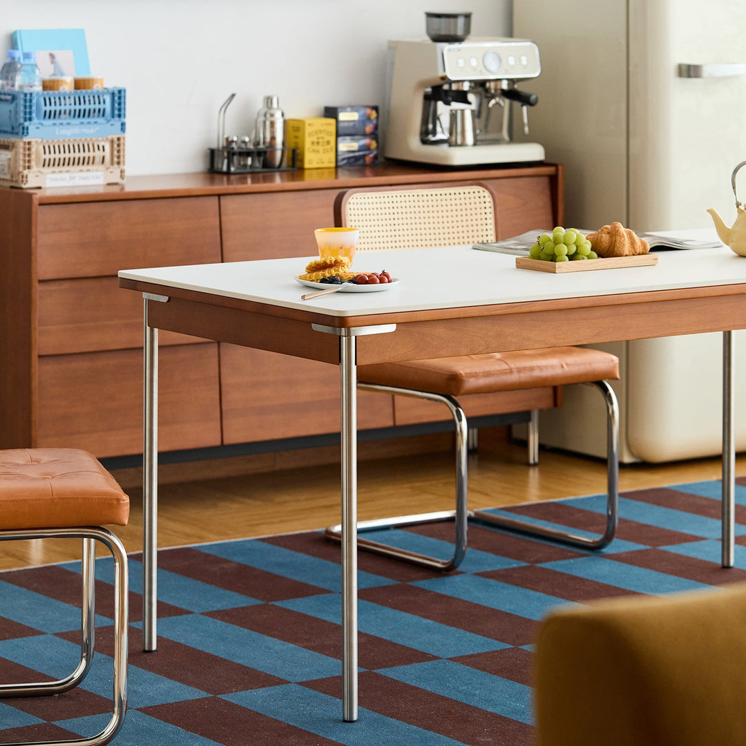 Bauhaus sintered stone boxwood dining table pinecone with context.