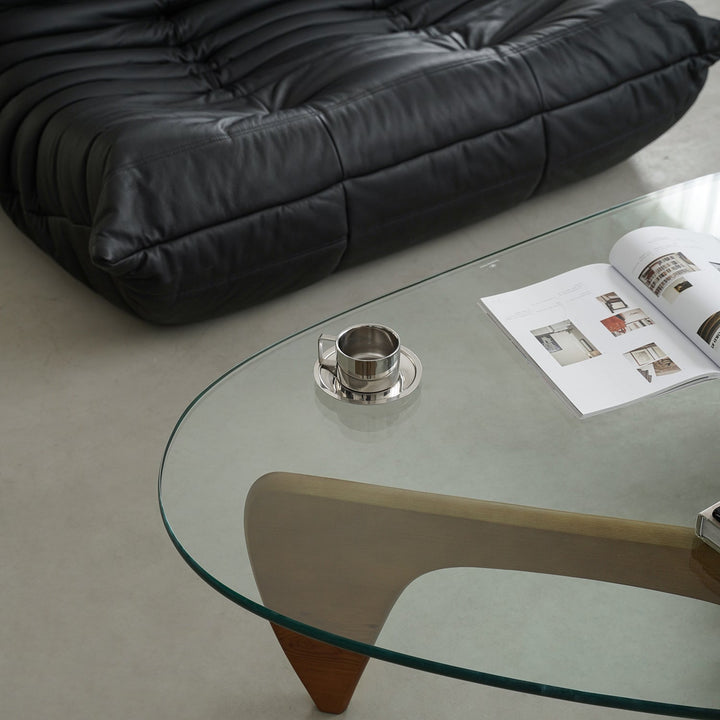 Vintage tempered glass coffee table noguchi with context.