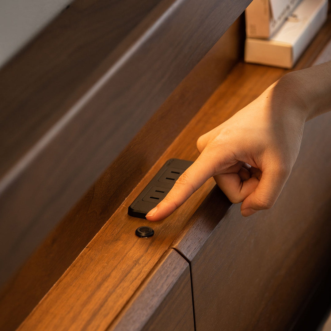 Vintage walnut wood bed accompany light in close up details.
