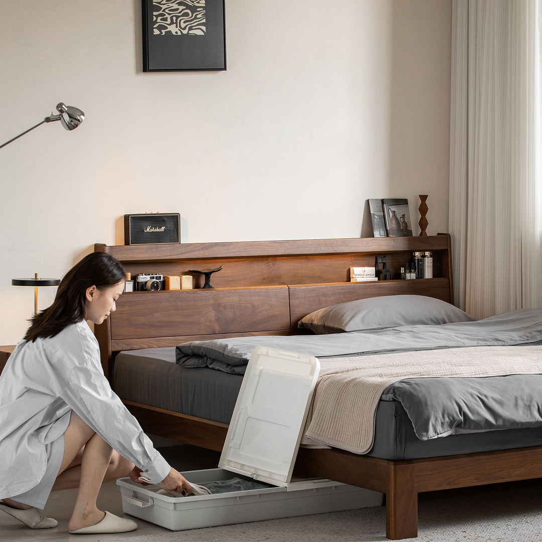 Vintage walnut wood bed accompany light in still life.