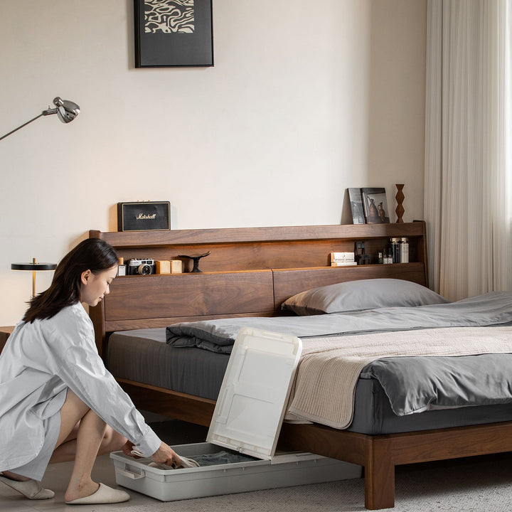 Vintage walnut wood bed accompany light in still life.