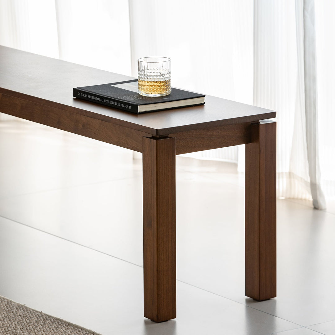 Vintage walnut wood dining bench coastal in close up details.