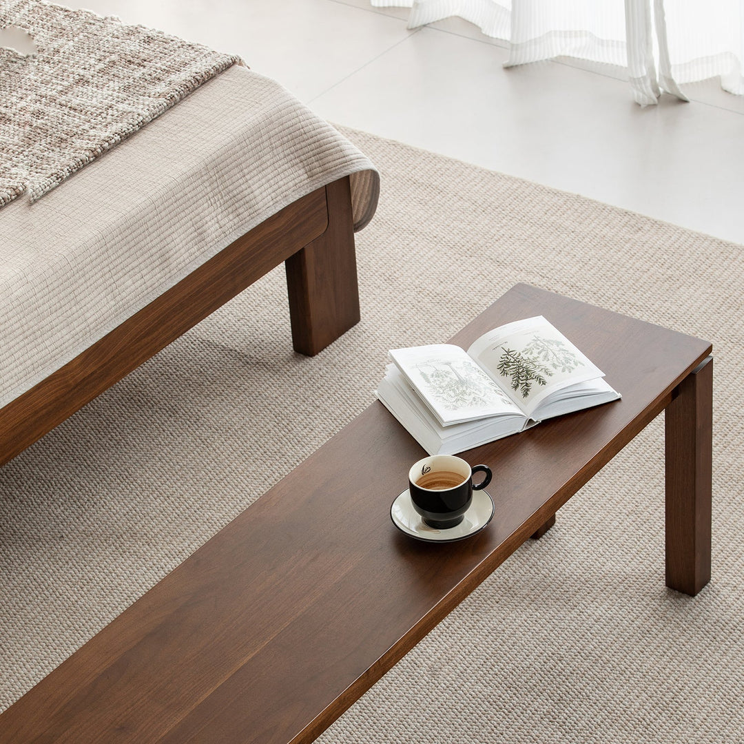 Vintage walnut wood dining bench coastal in panoramic view.
