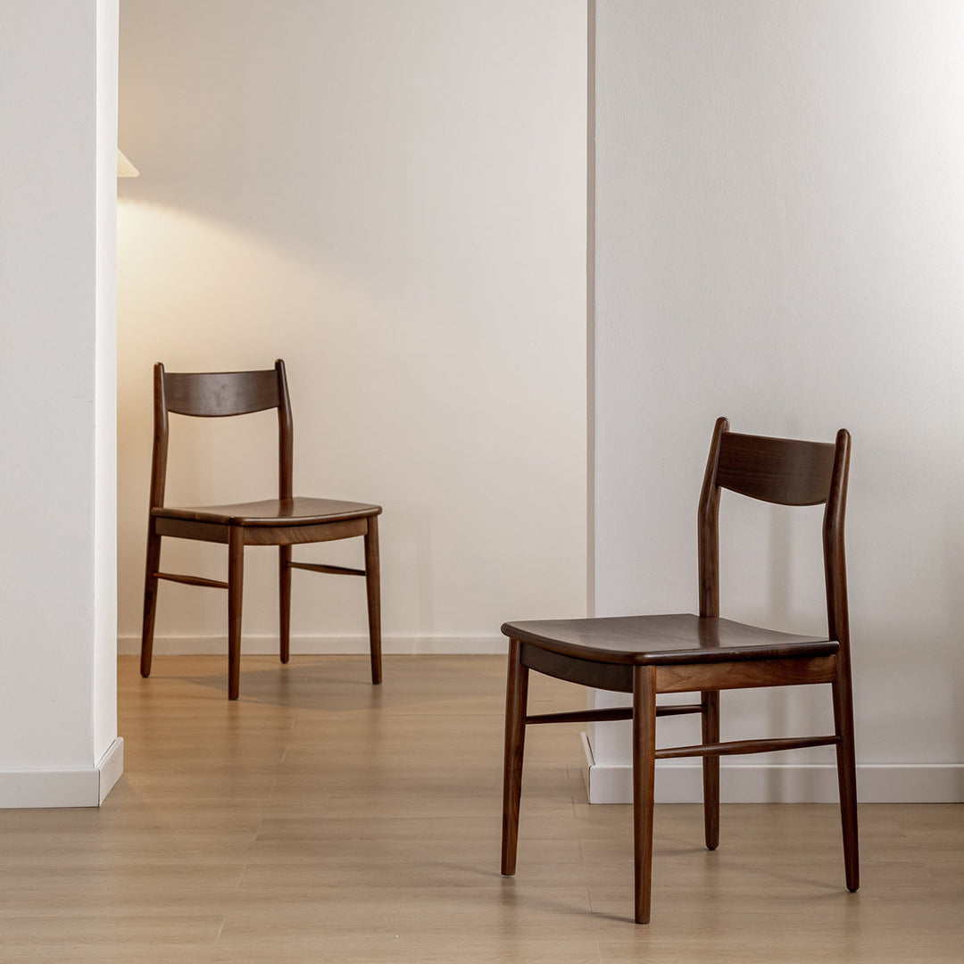Vintage walnut wood dining chair chrono in panoramic view.