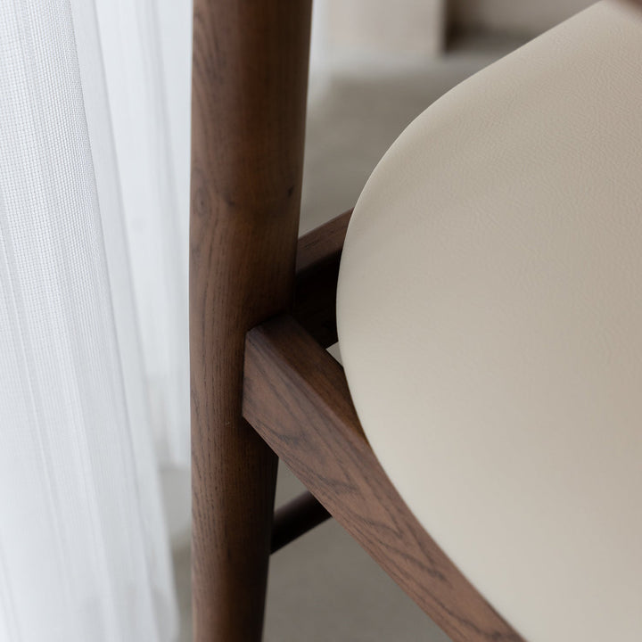 Vintage walnut wood dining chair purea in real life style.