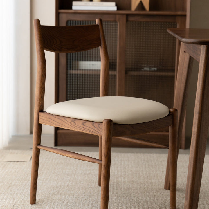 Vintage walnut wood dining chair purea with context.