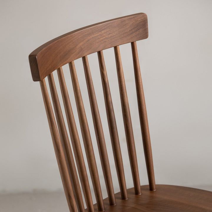 Vintage walnut wood dining chair windsor in close up details.