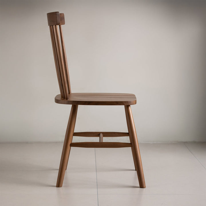 Vintage walnut wood dining chair windsor in panoramic view.