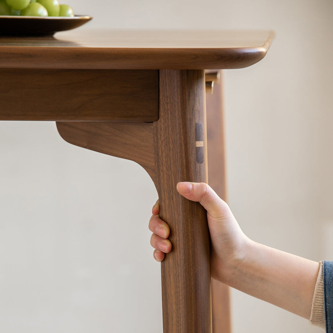 Vintage walnut wood dining table chrono in still life.