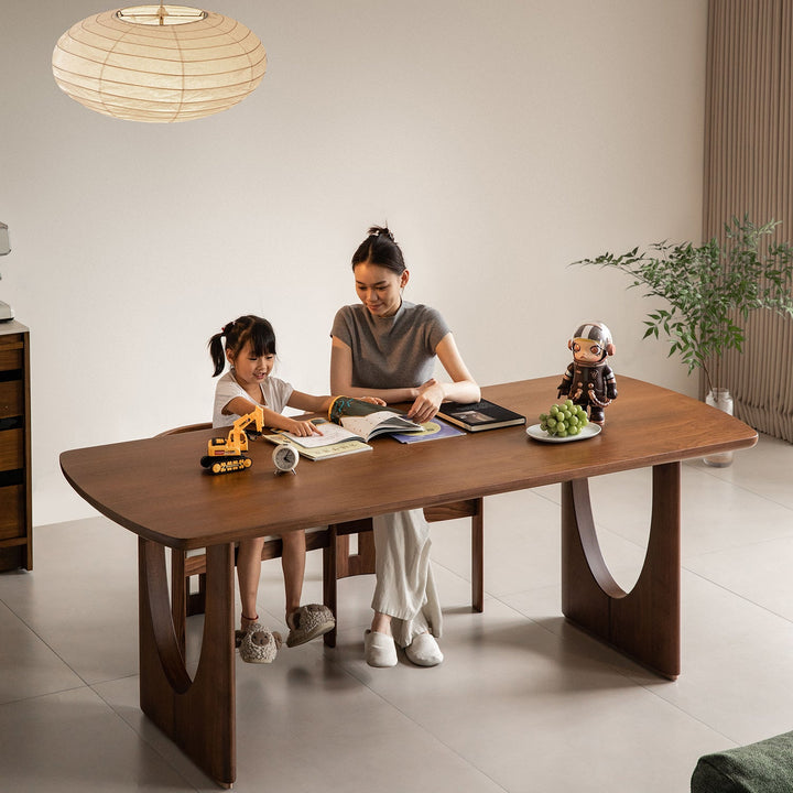 Vintage walnut wood dining table rockwel in real life style.