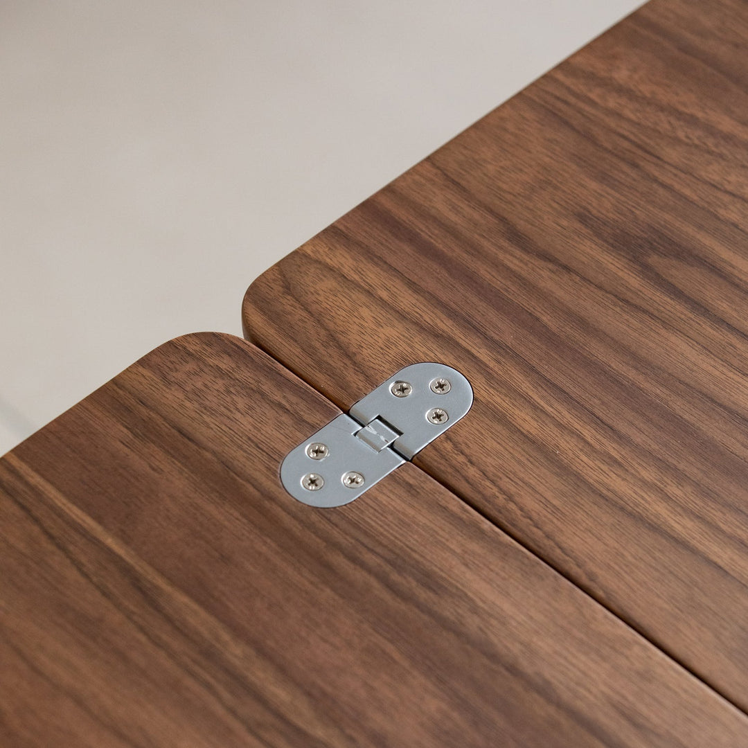 Vintage walnut wood extendable coffee table vorin in still life.