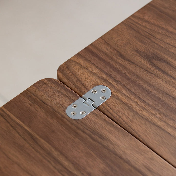 Vintage walnut wood extendable coffee table vorin in still life.