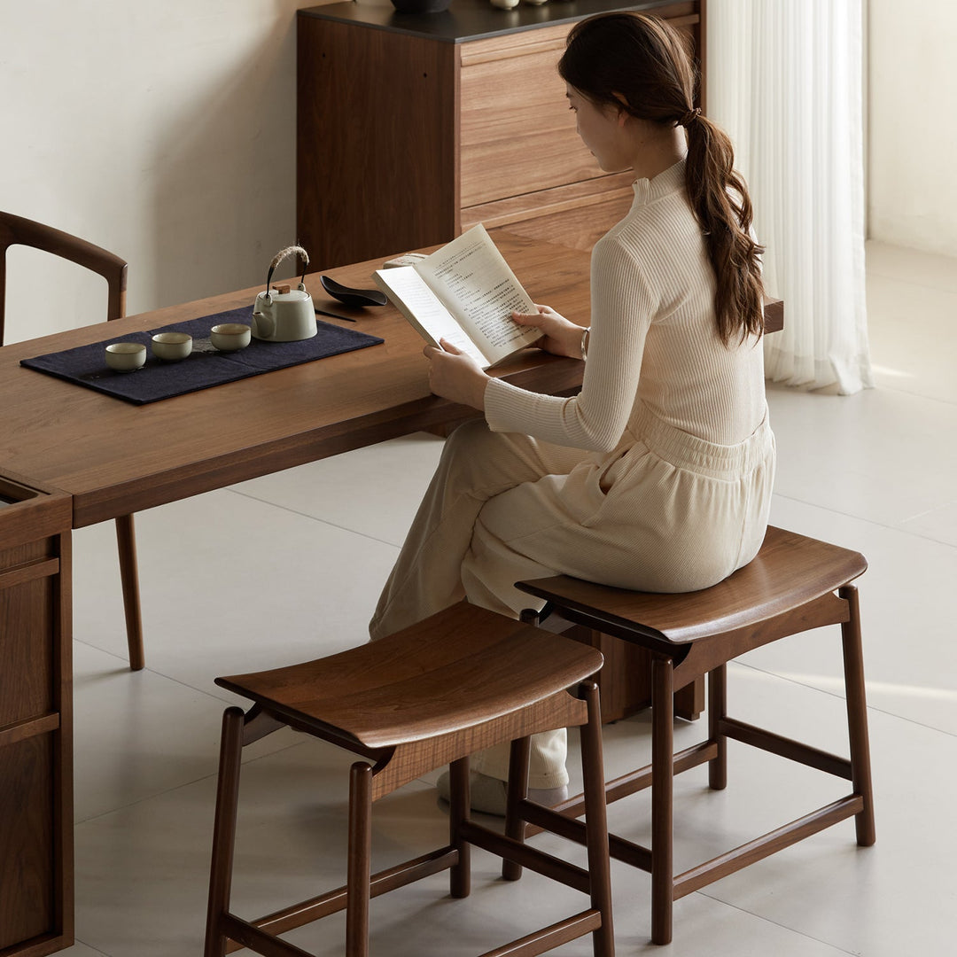 Vintage walnut wood stool arcus in still life.